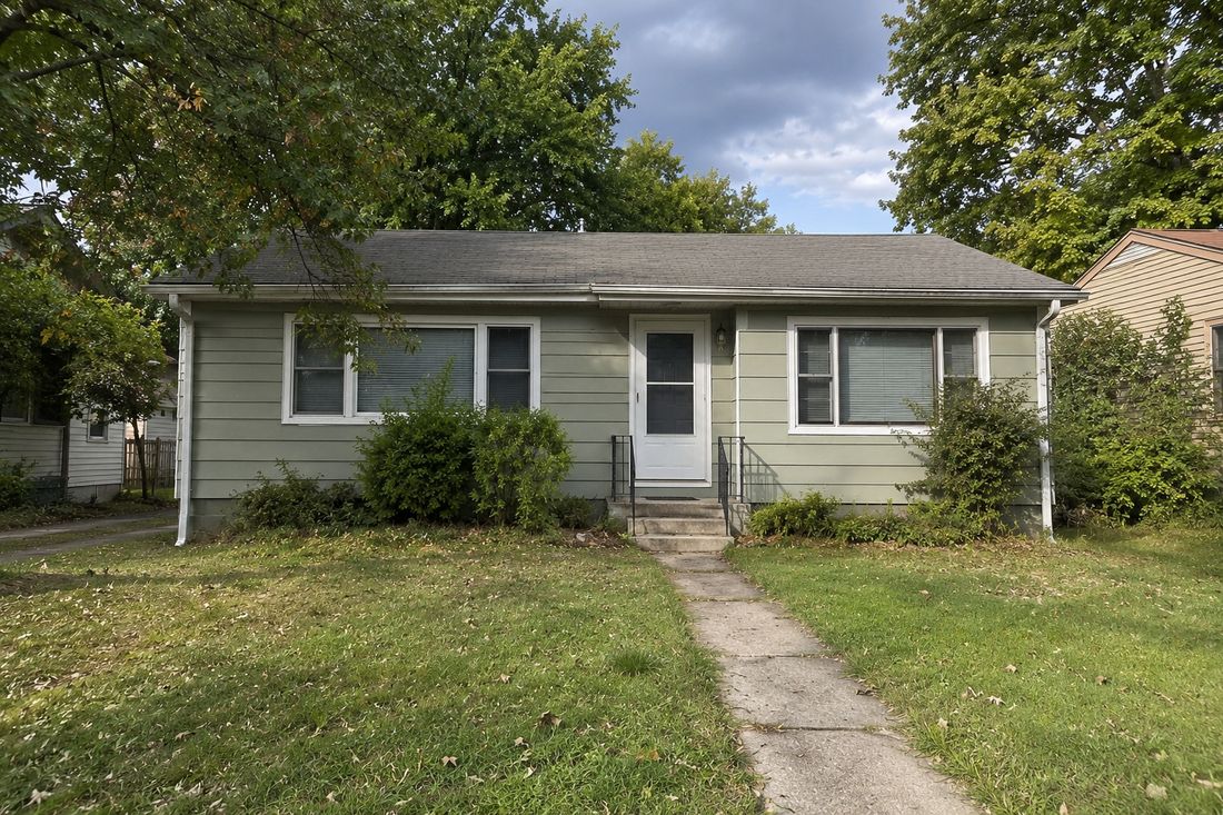 A modest single-story ranch with a front walkway
